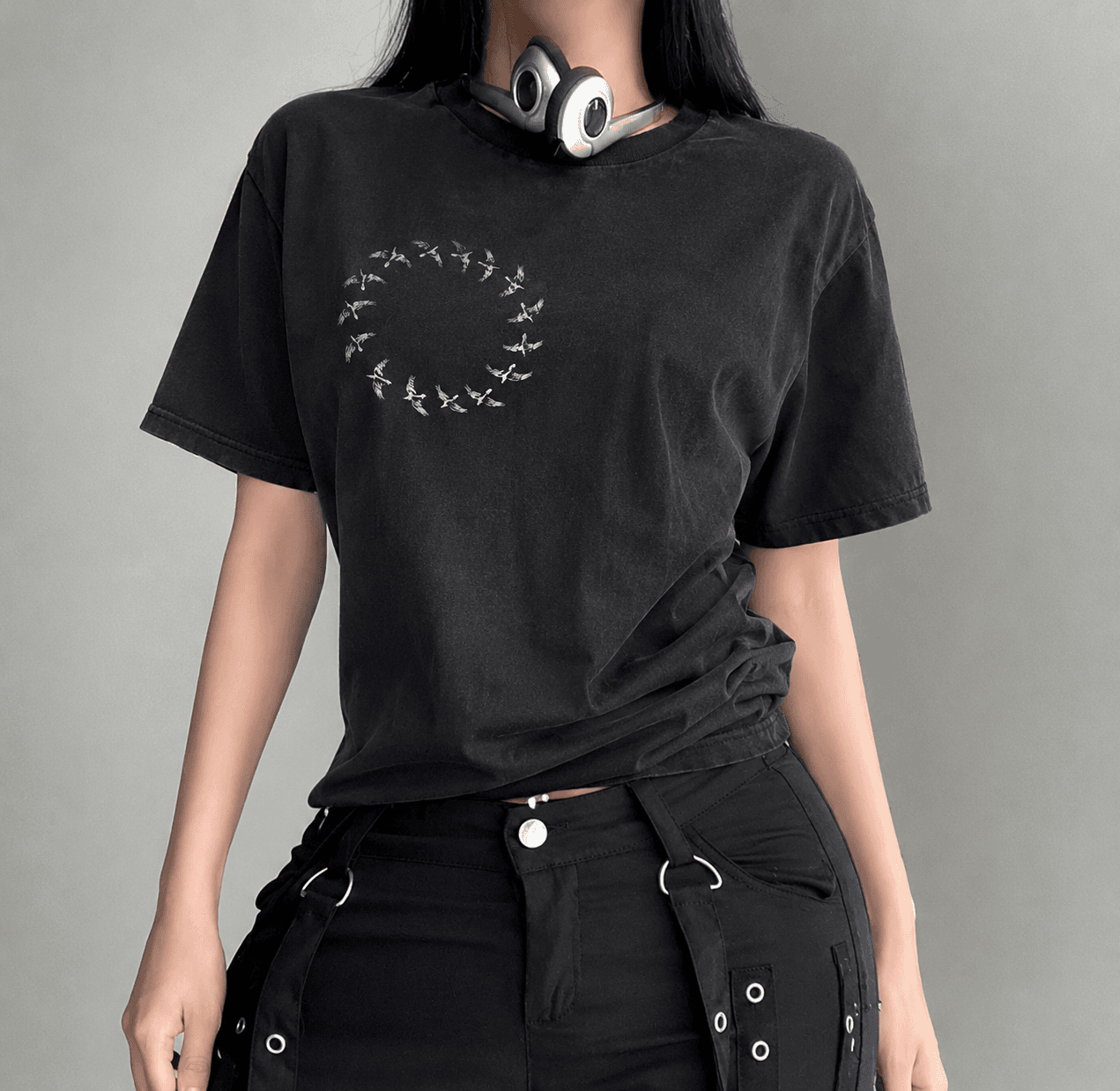 Model wearing the tee, front ring of birds visible